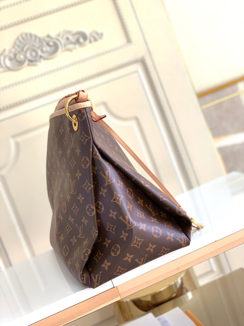 Bolsa Louis Vuitton Artsy Monograma MM